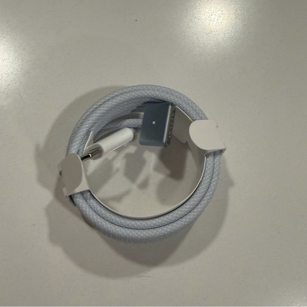 Apple USB-C to MagSafe 3 Cable in black. MacBook charger